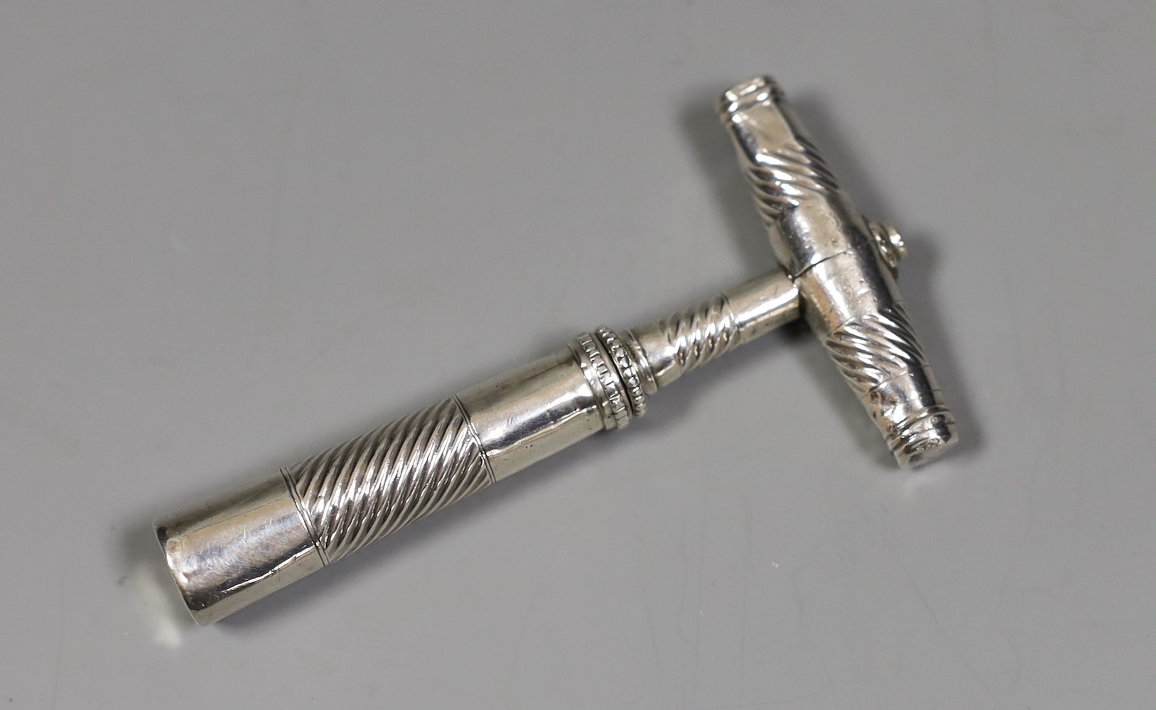 A George III silver travelling corkscrew, by Samuel Pemberton, 78mm.